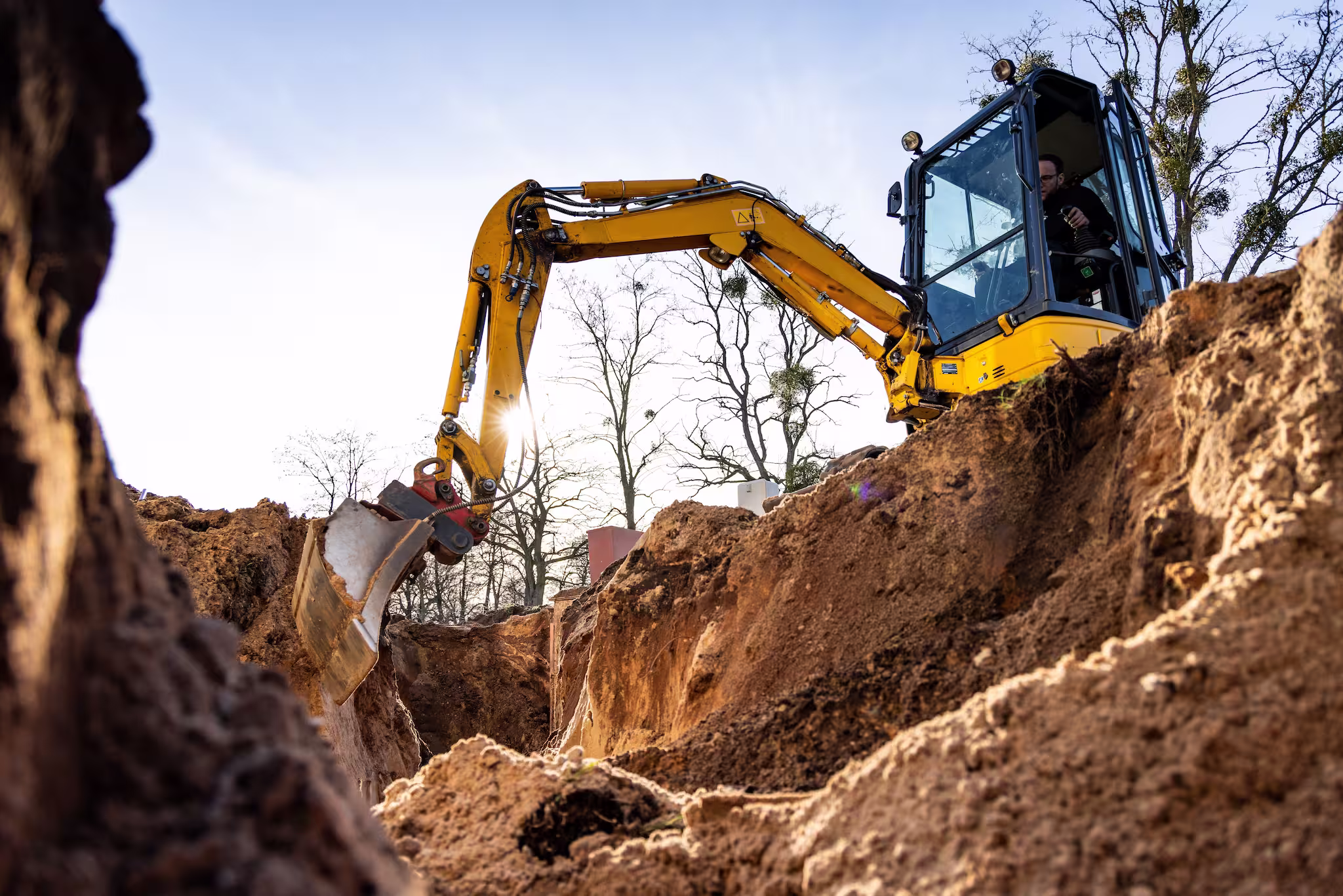 Excavator digging a hole in the ground