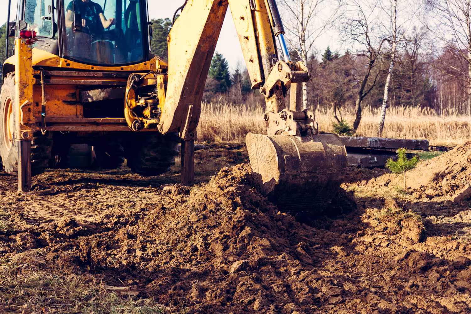 Bucket picking up soil