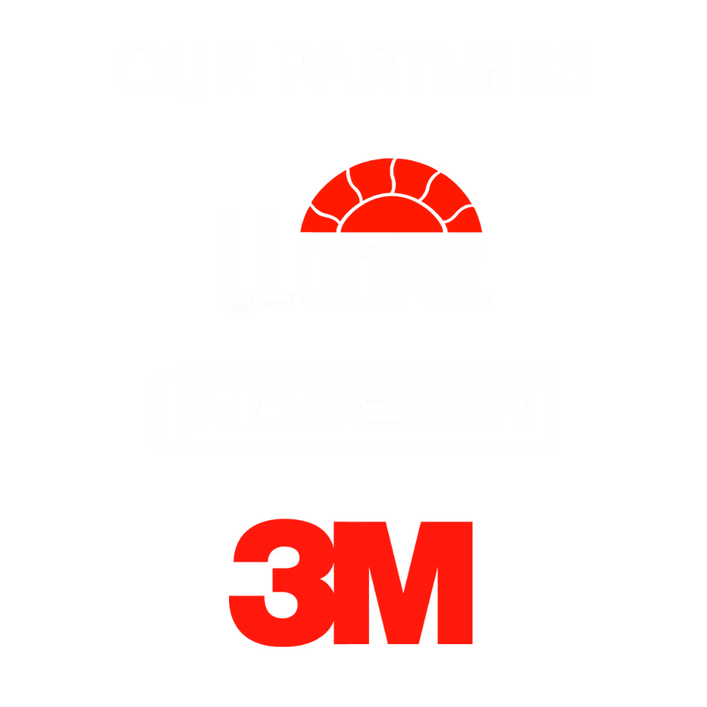 Person applying a protective film wrap on a grey car hood using a black squeegee tool to smooth out air bubbles and water droplets.