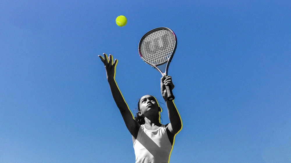 Teen girl playing tennis