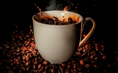 American Heart Association Statement: Coffee's fine. Energy drinks aren't. Up to 400mg of caffeine a day is safe for most hearts. The can is your fridge is another story.