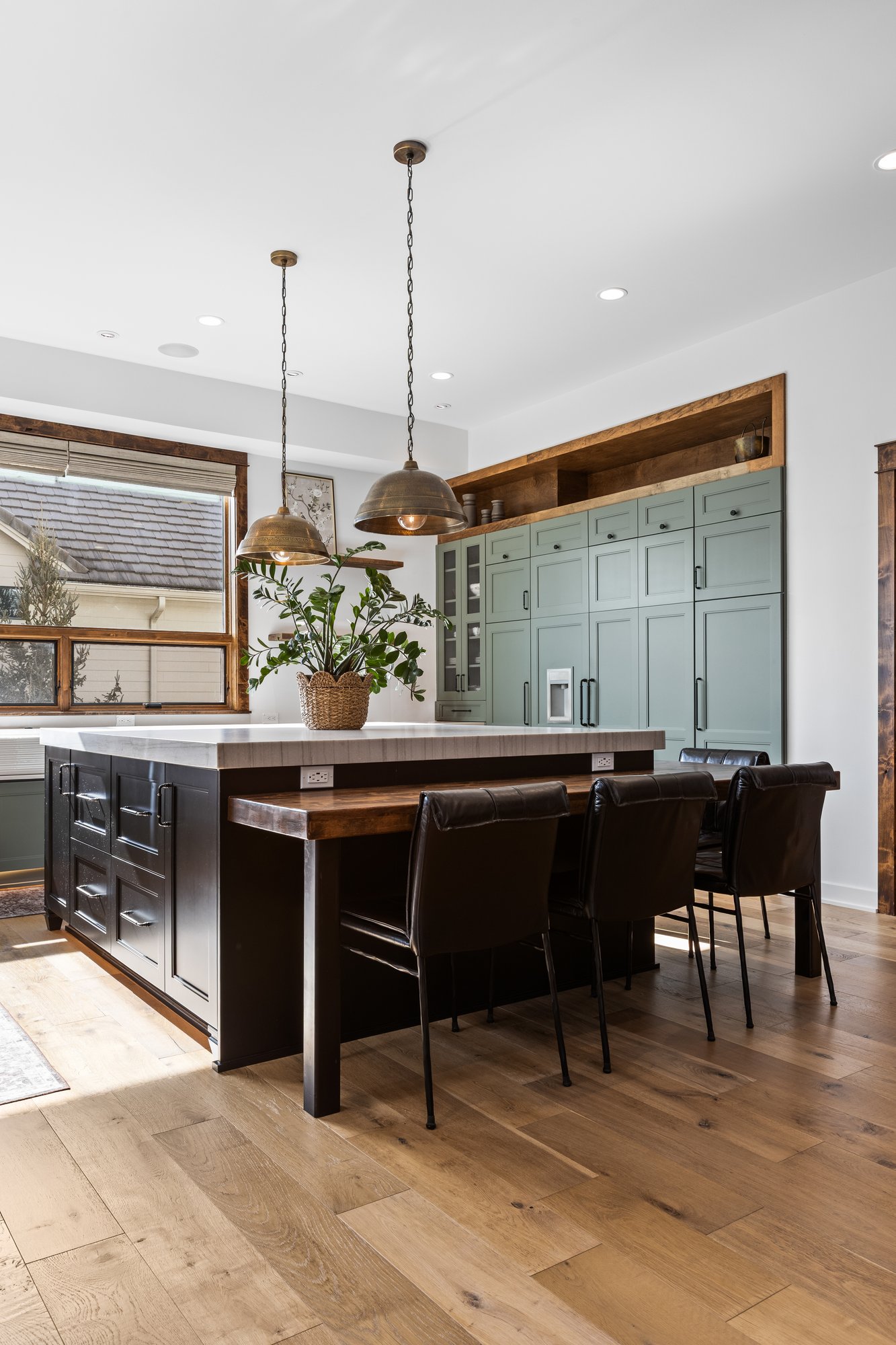 Kitchen island with designer pendants