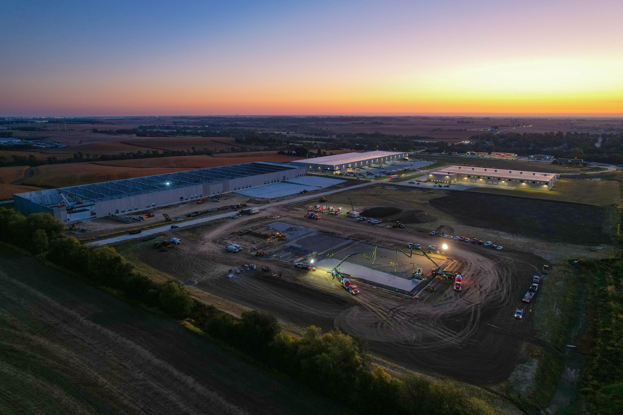 Aerial of commercial concrete pour at sunset