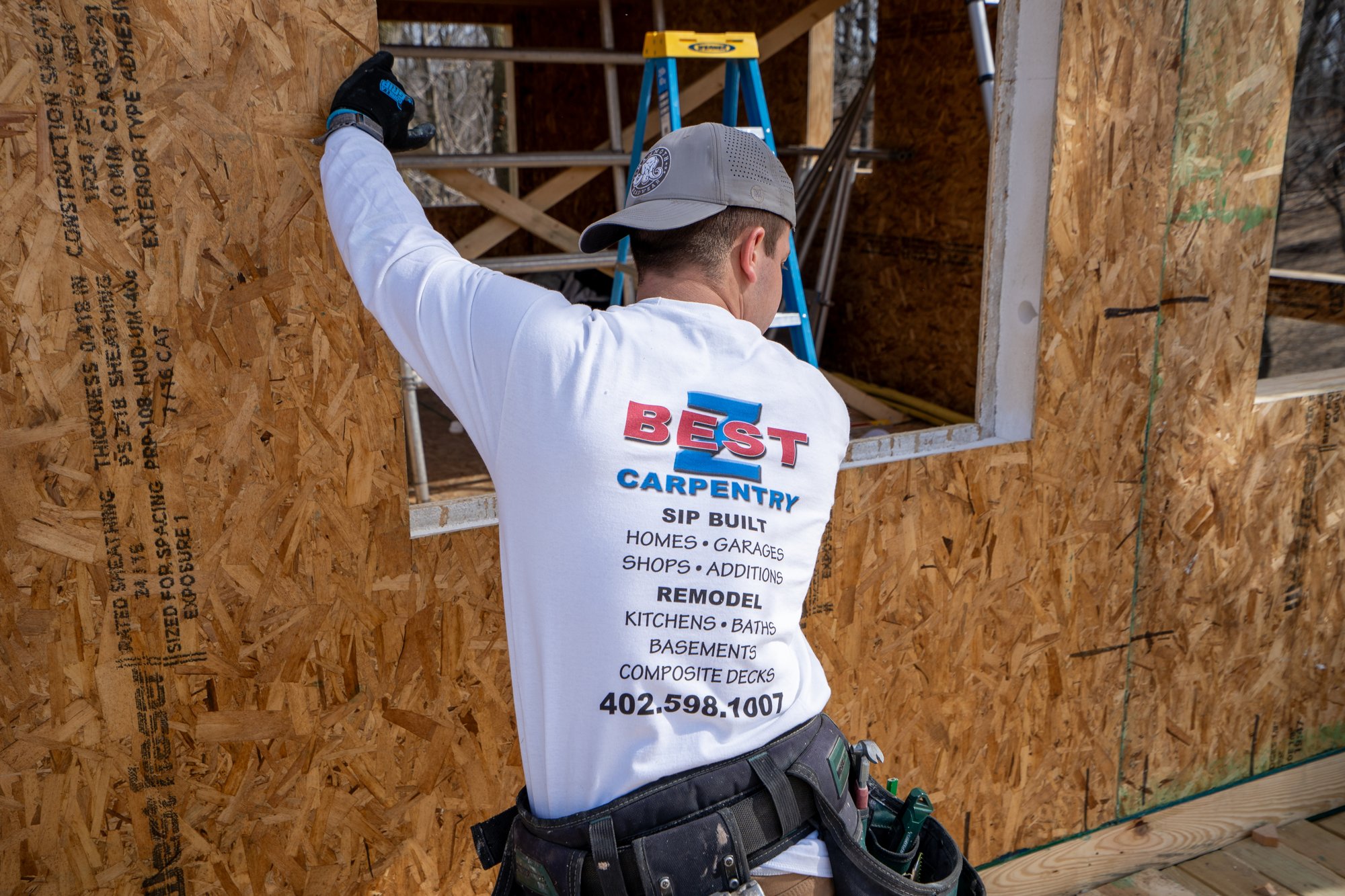 Carpenter installing SIP panel window