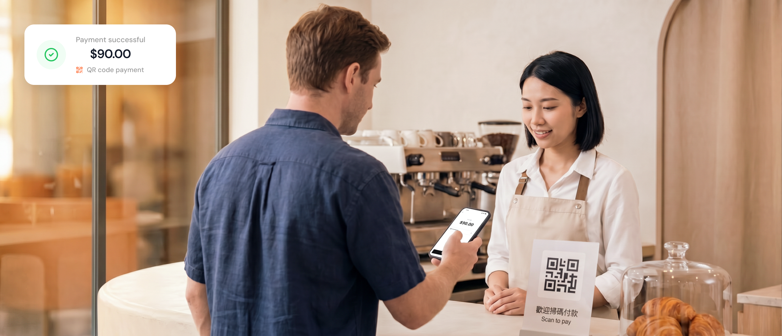 Customer scanning a QR code standee with a phone at a cafe counter, showing a successful HK$90 payment