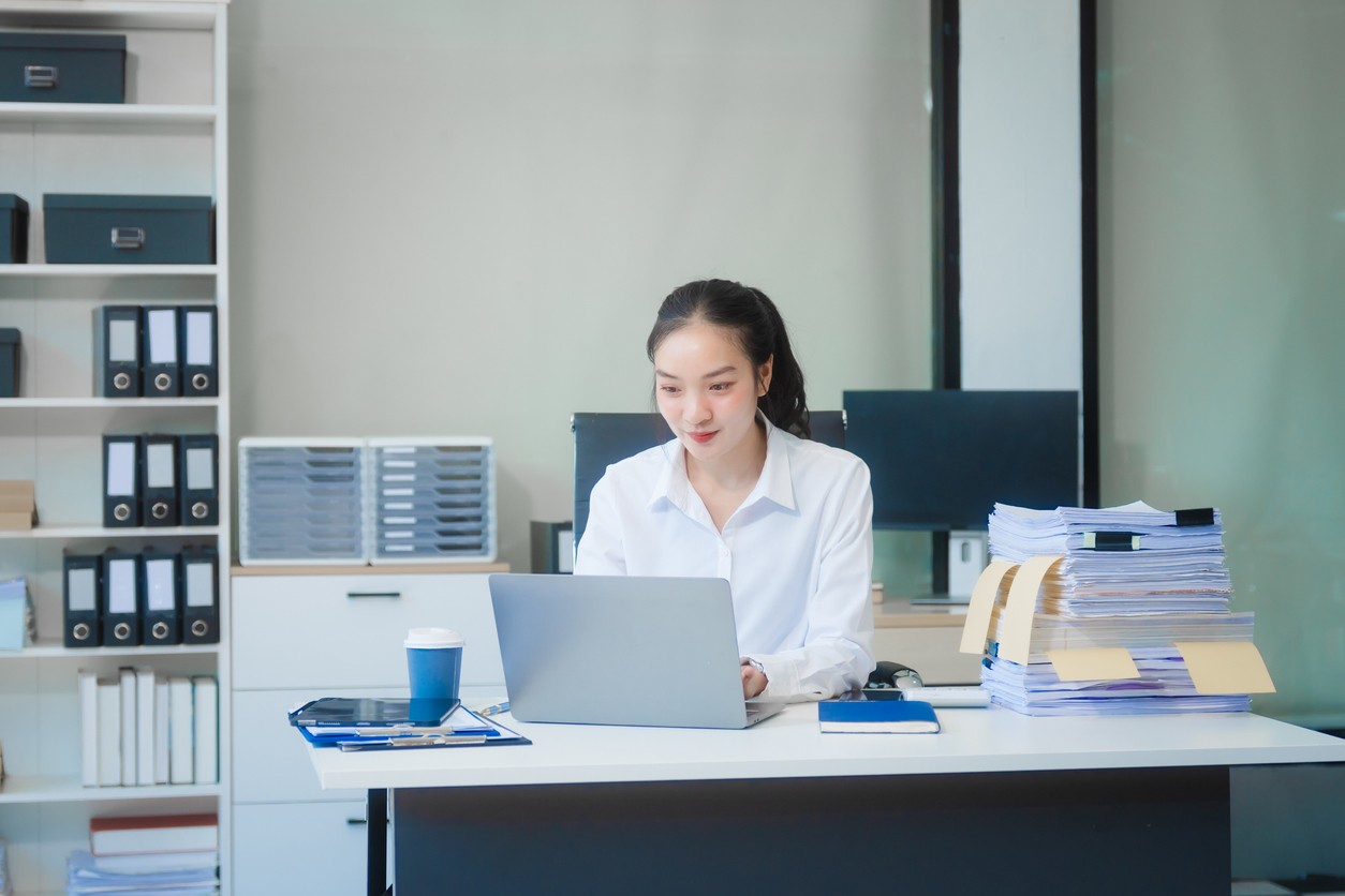 woman at desk focusing on payment methods