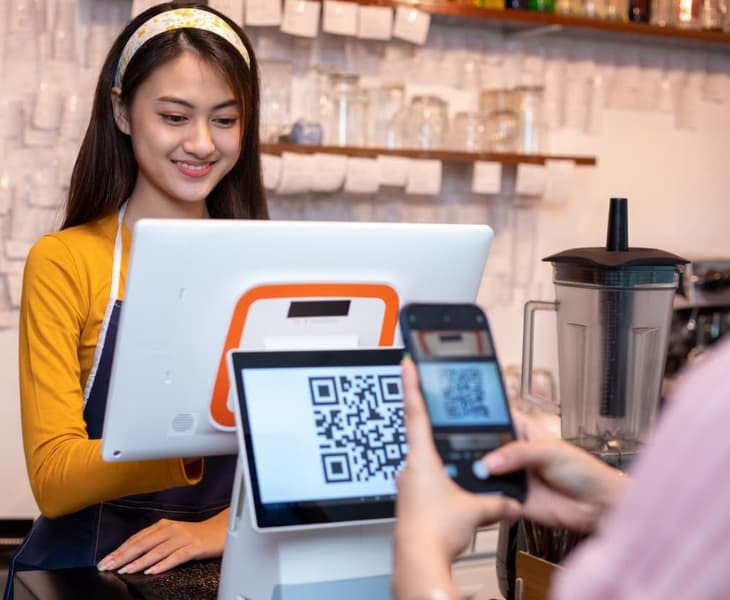 woman scanning a dynamic qr code
