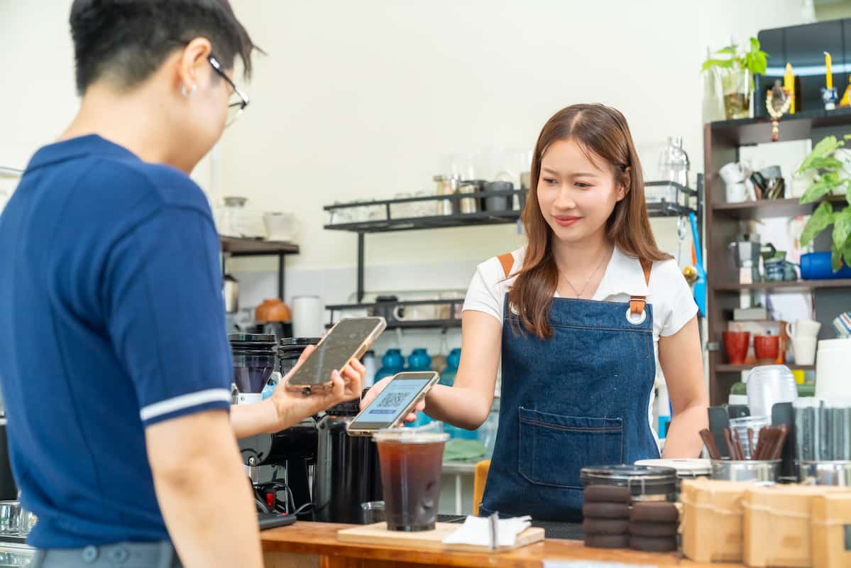 man paying by qr code payment