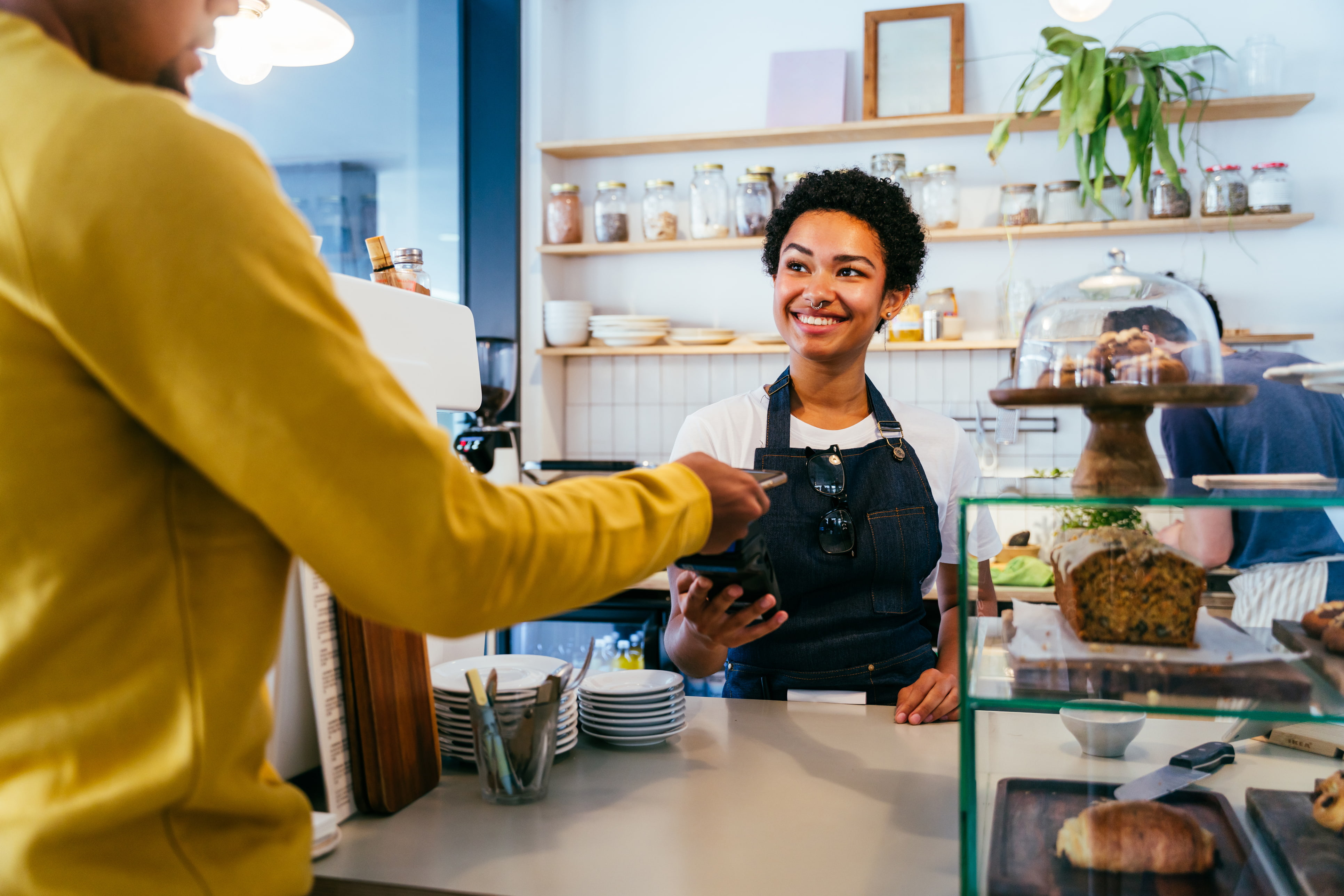 woman smiling at counter