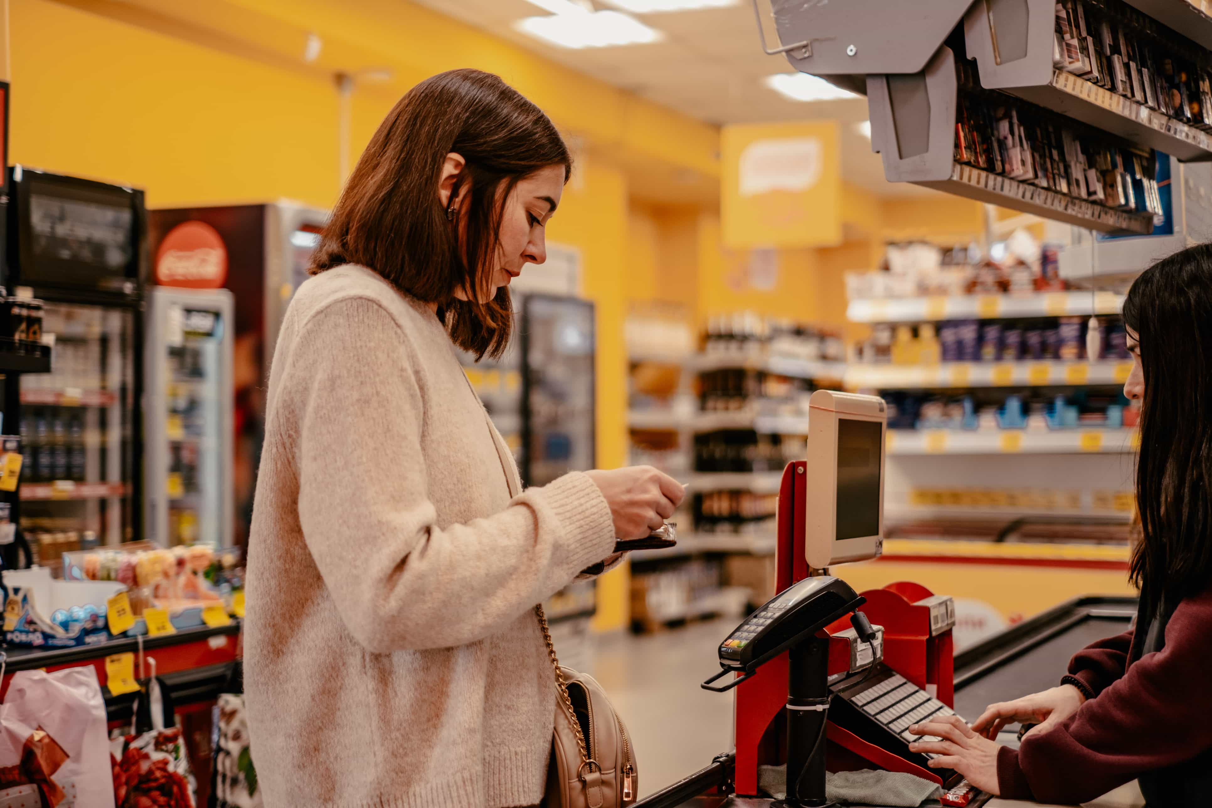 woman paying at counter