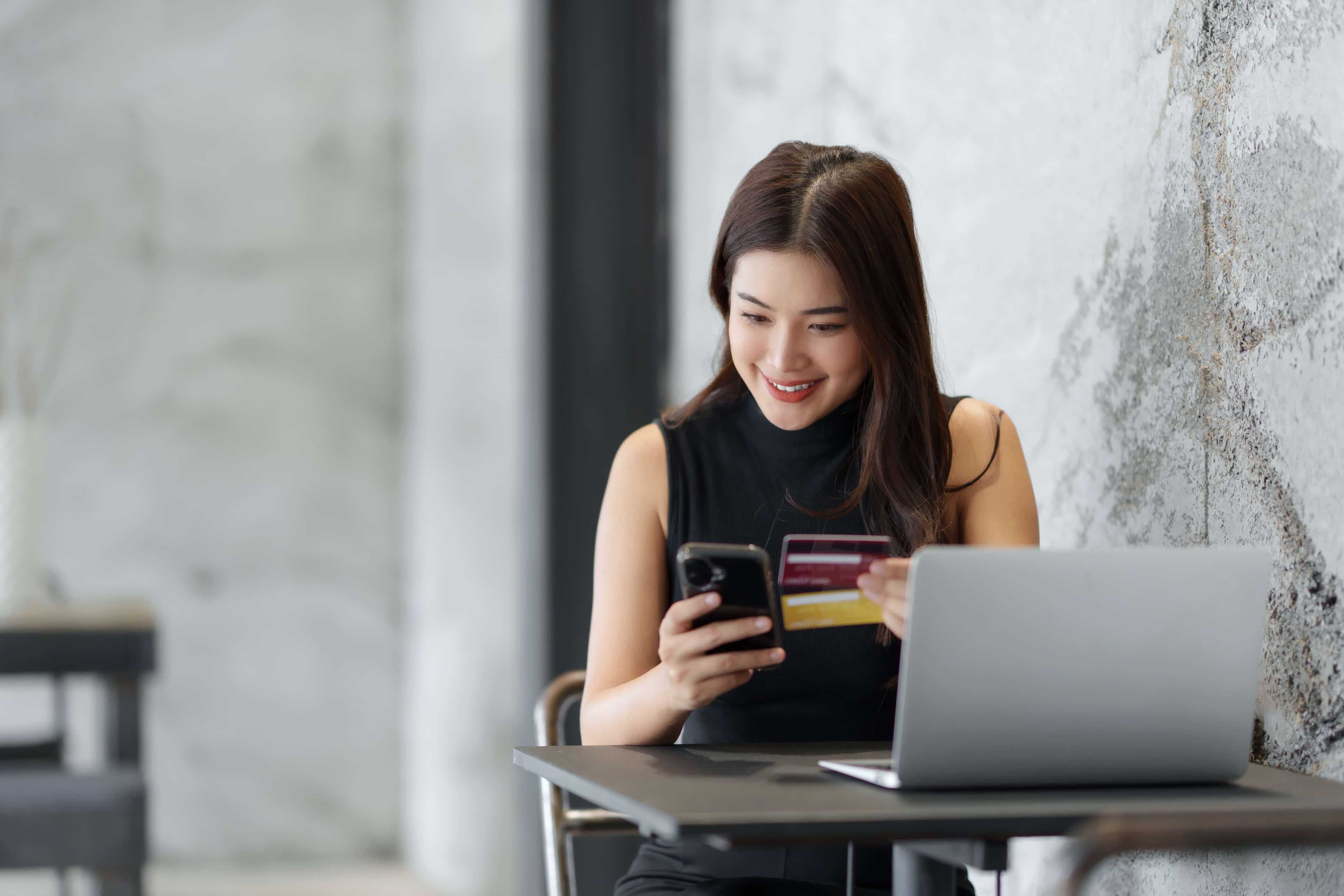 asian woman using corporate credit card for business