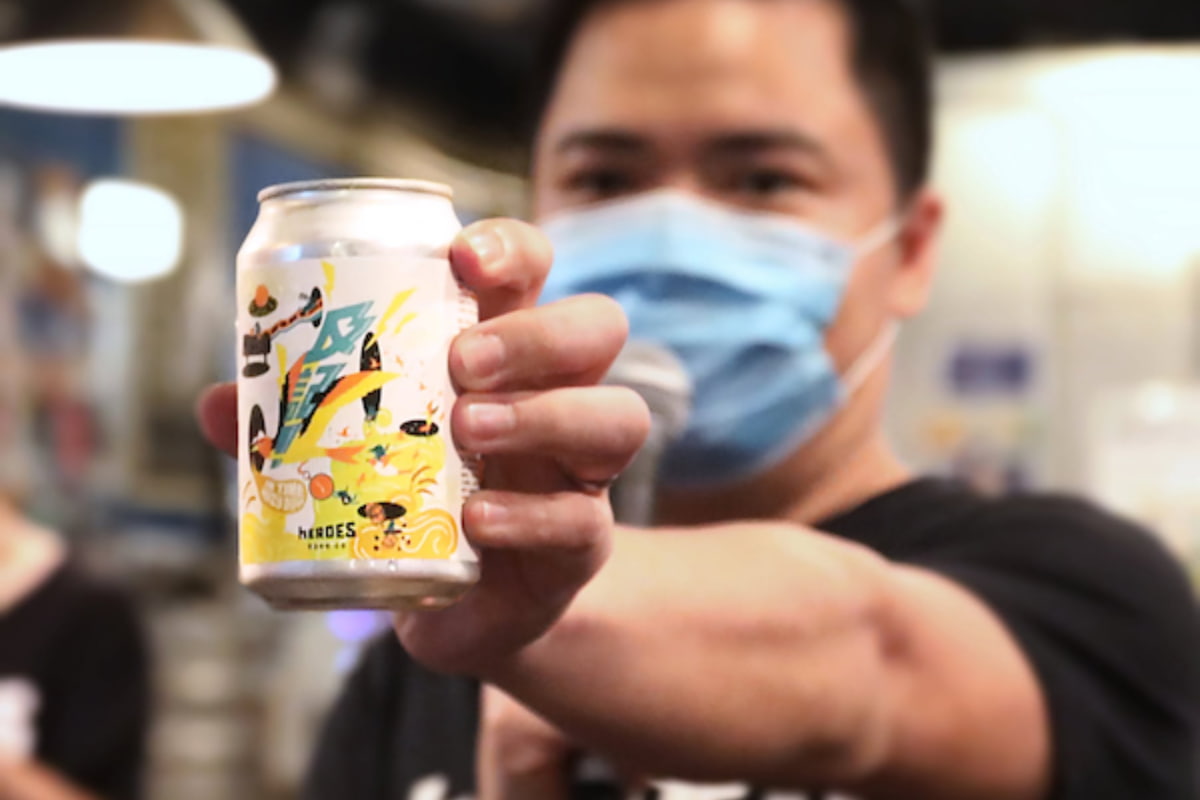 Man offering a can of beer