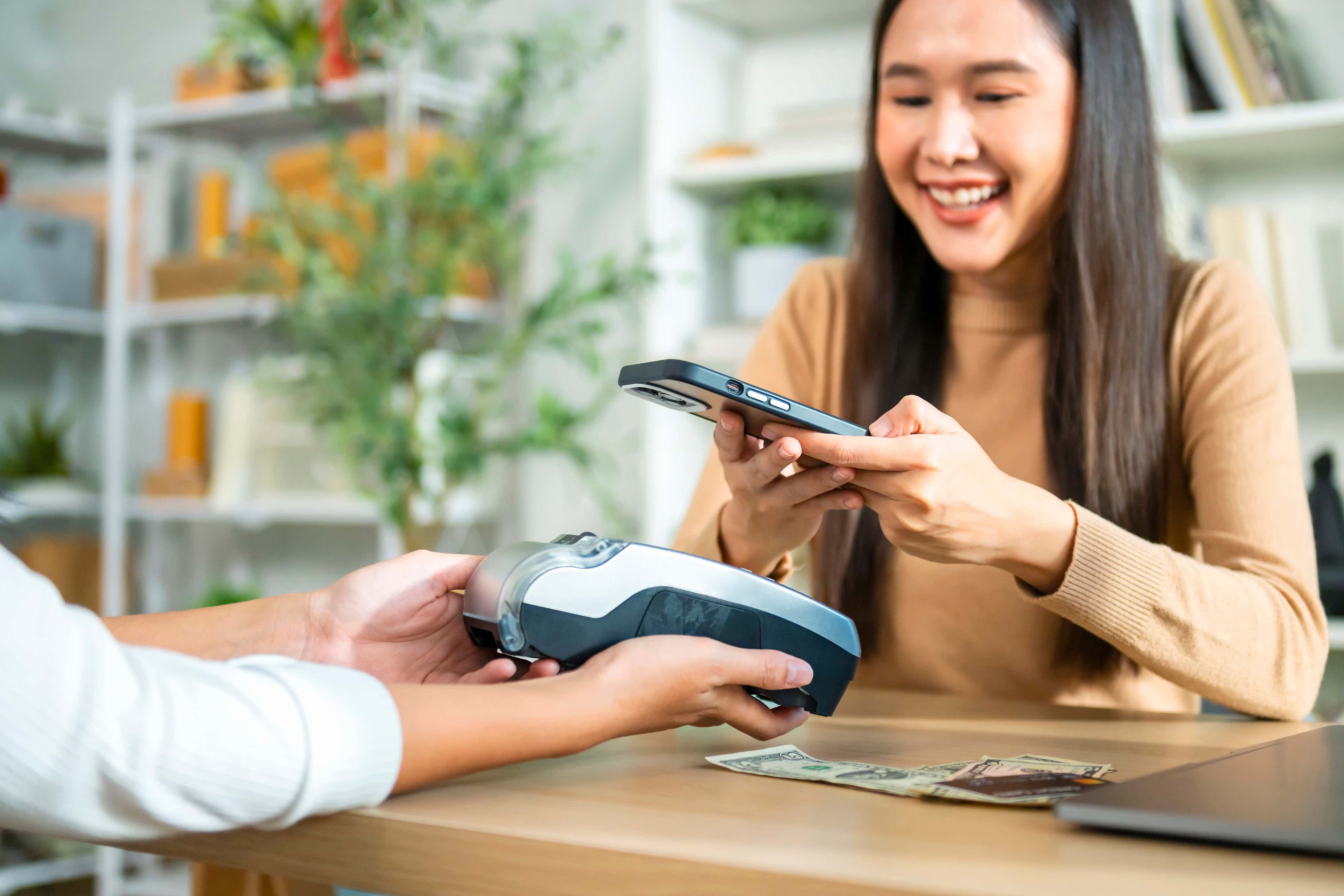 asian woman making electronic payment