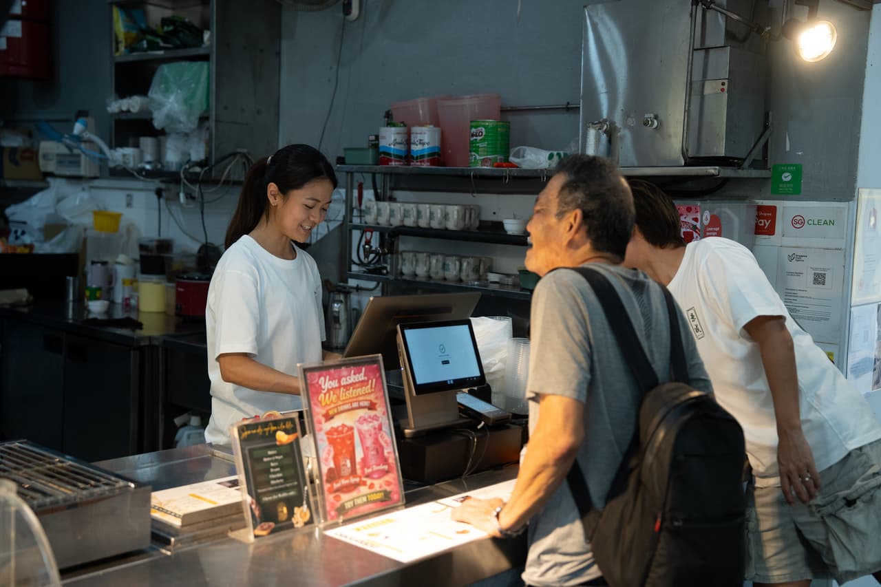 keng seng coffeehouse staff using kpay pos terminal