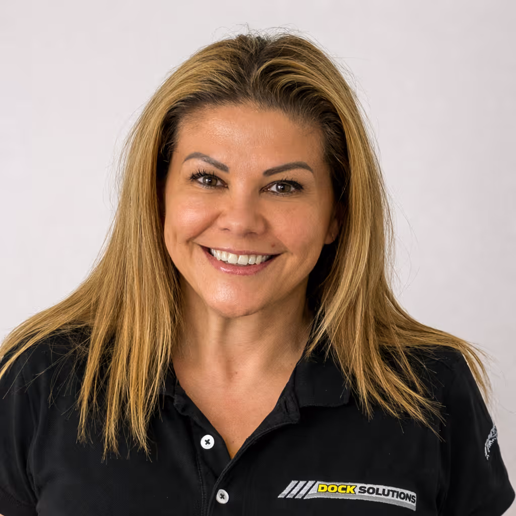 Smiling woman with straight blonde hair wearing a black polo shirt with a Dock Solutions logo on the chest.