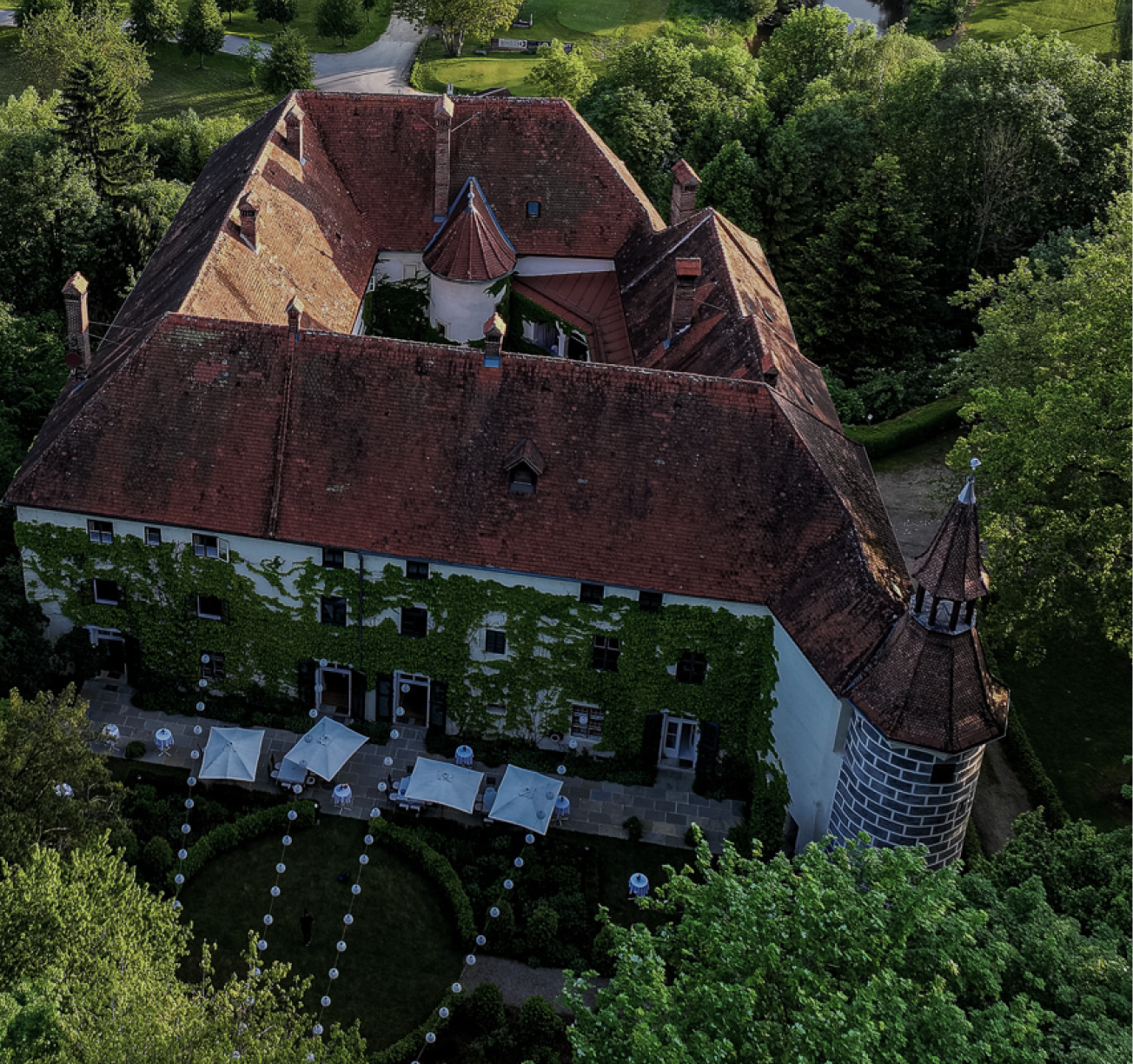 A statue of a mermaid in a garden
