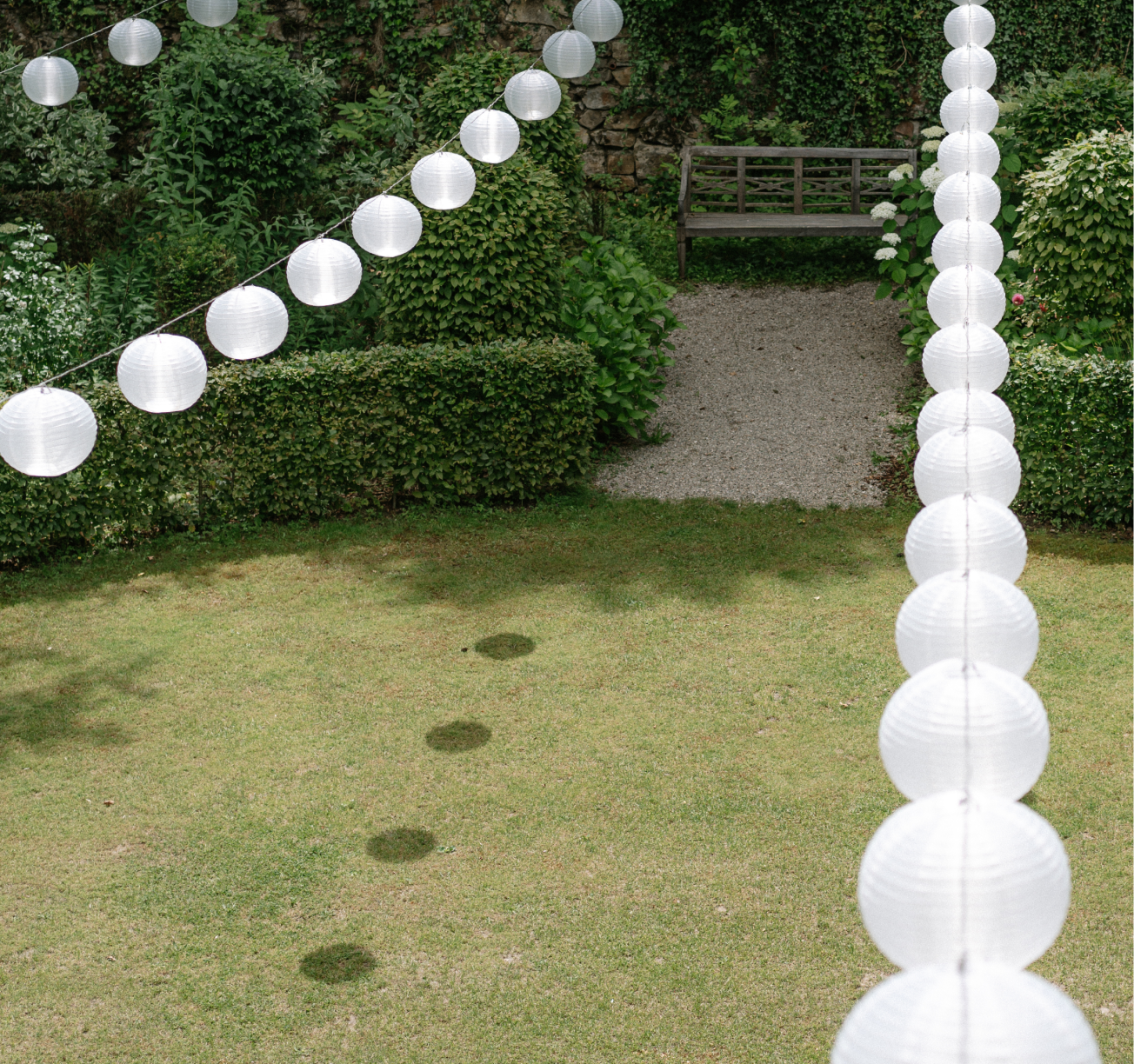 A statue of a mermaid in a garden