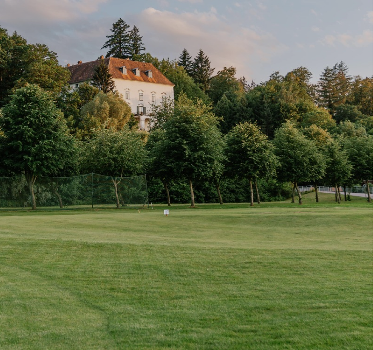 A statue of a mermaid in a garden