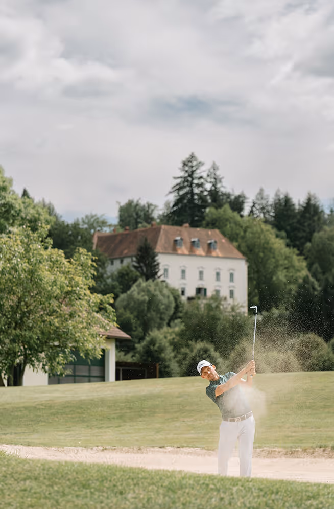 A statue of a mermaid in a garden
