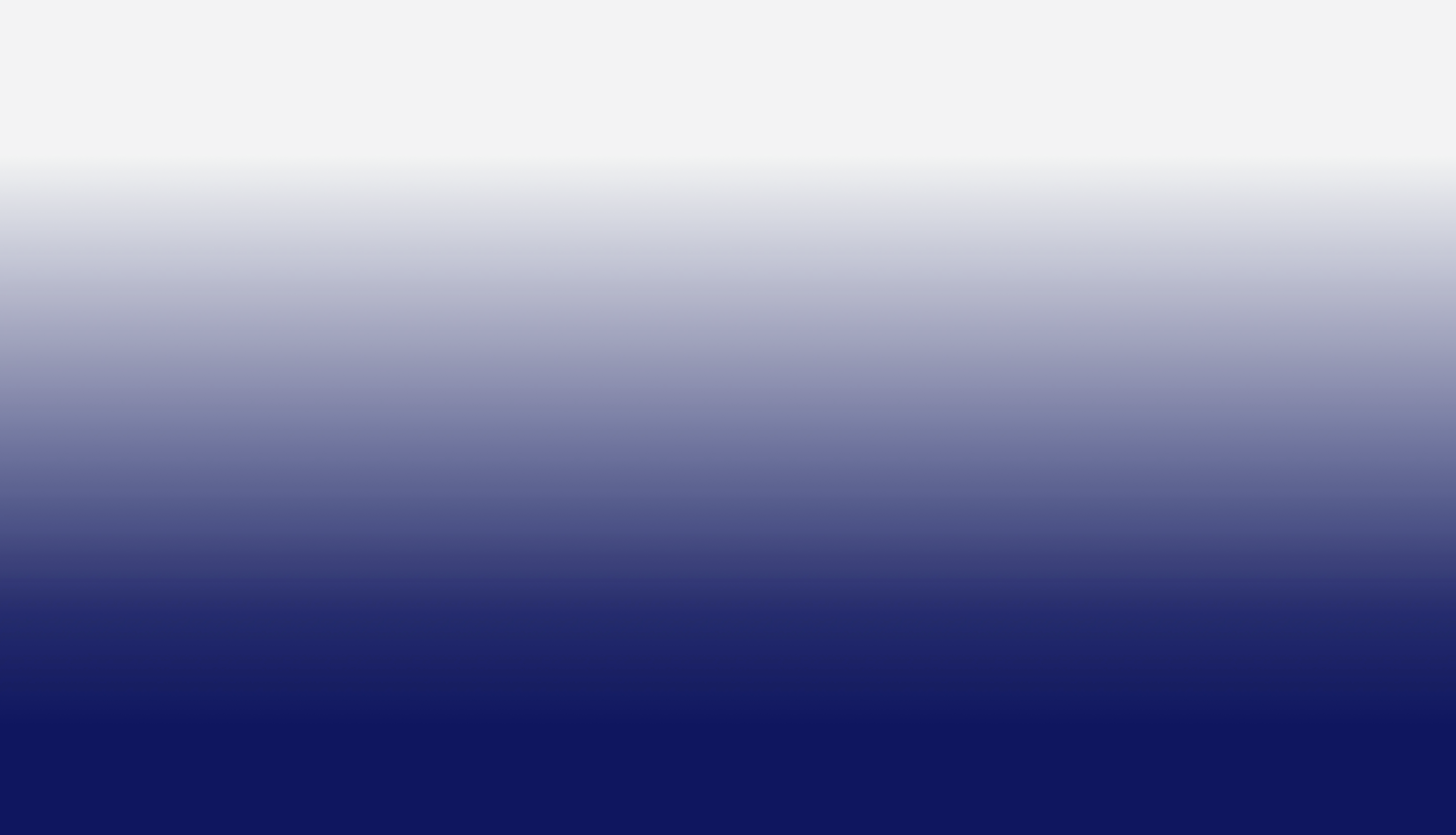 Clear blue sky over a vast body of calm ocean water with a dark horizon.