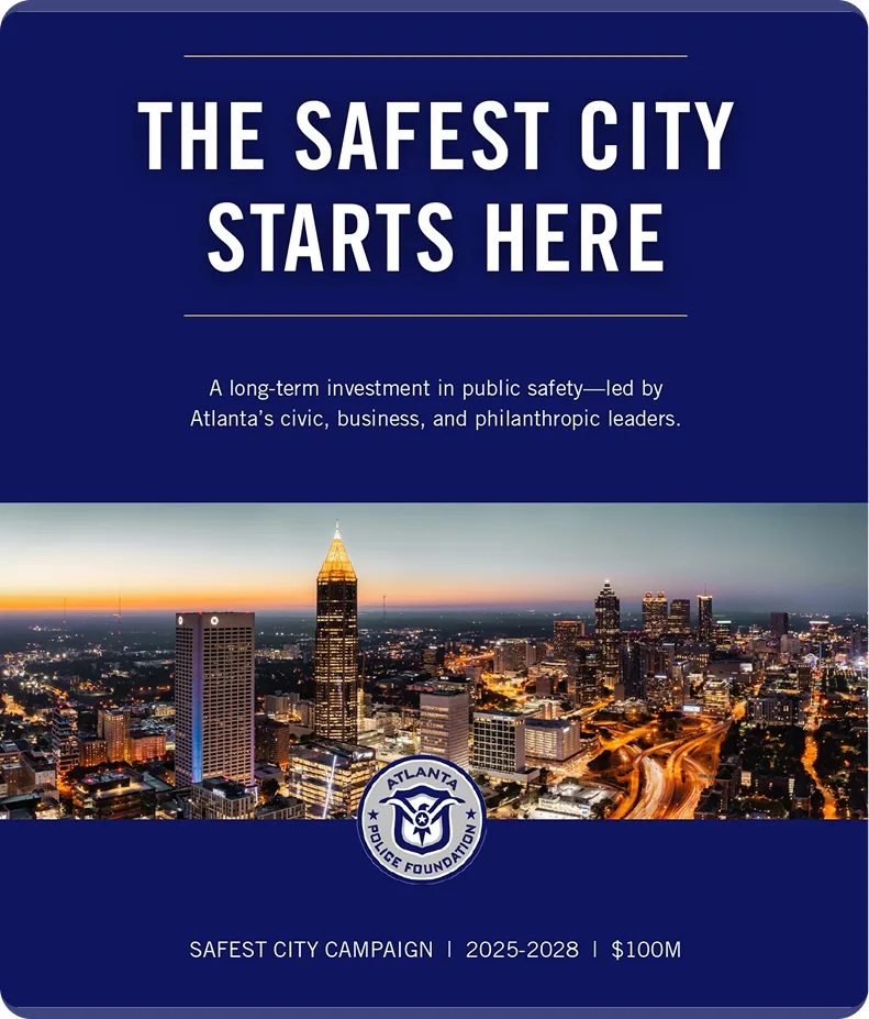 Campaign poster with the headline 'The Safest City Starts Here' above a nighttime cityscape of Atlanta, featuring illuminated buildings and roads, and the Atlanta Police Foundation logo below. Text highlights a long-term investment in public safety led by Atlanta’s civic, business, and philanthropic leaders, and notes the Safest City Campaign from 2025 to 2028 with a $100 million goal.