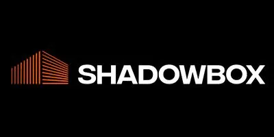 Shadowbox logo featuring an abstract red-orange geometric shape resembling a 3D box or a series of parallel lines forming a corner on a black background with the word 'SHADOWBOX' in bold white capital letters to the right.