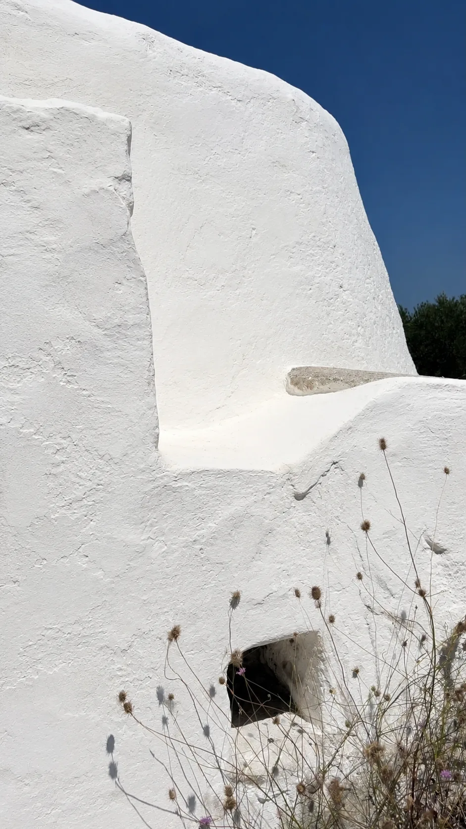 Renovated rural volume at Tenuta San Biagio with essential geometry and lime plaster surfaces