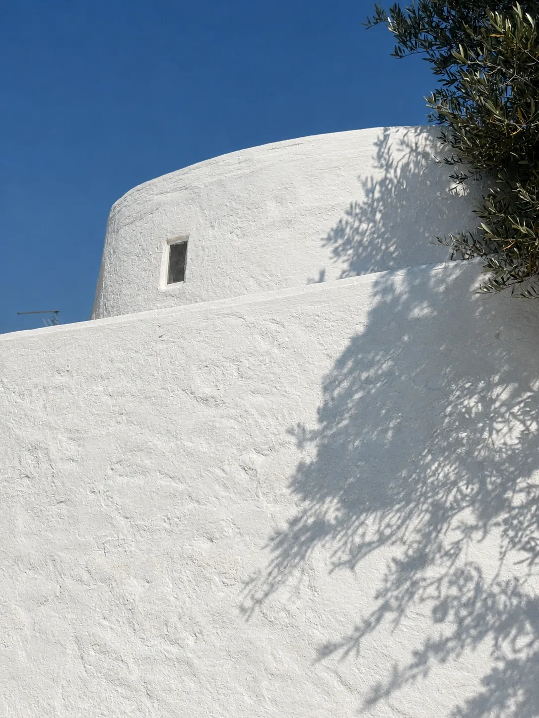 Sculptural carved volumes at Tenuta San Biagio capturing Mediterranean light