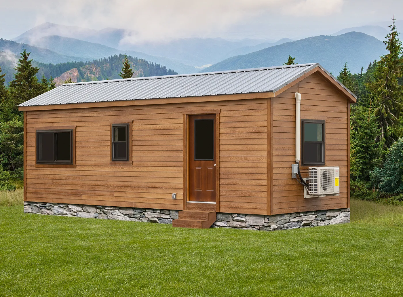 Small brown wooden cabin with metal roof, stone foundation, and an air conditioning unit.