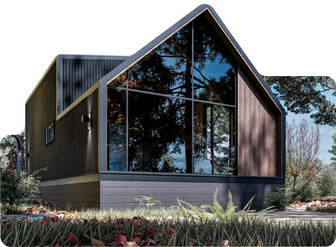 Modern cabin with large triangular glass window reflecting trees, surrounded by grass and autumn leaves.