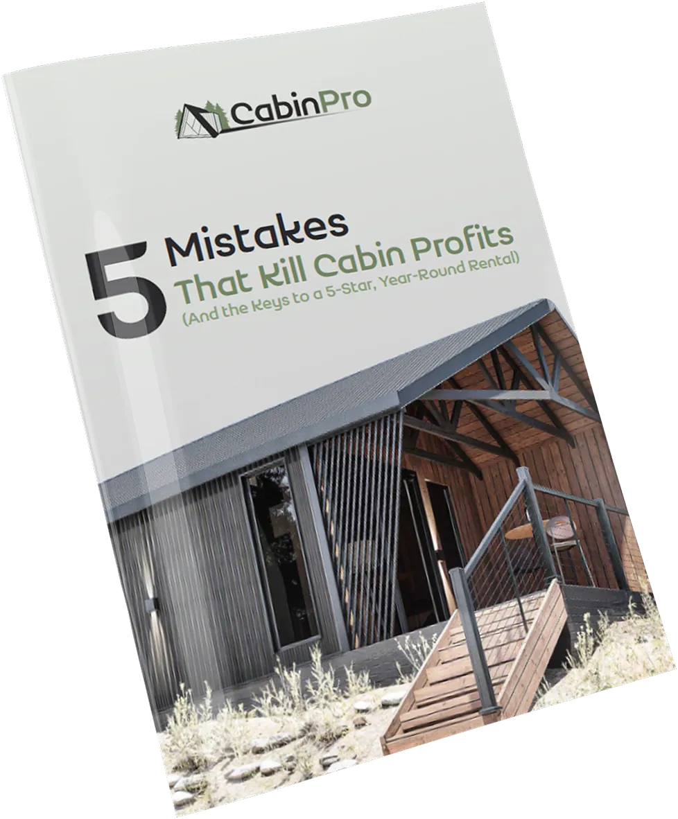 Cover of a CabinPro guide titled '5 Mistakes That Kill Cabin Profits (And the Keys to a 5-Star, Year-Round Rental)' featuring a modern cabin exterior.