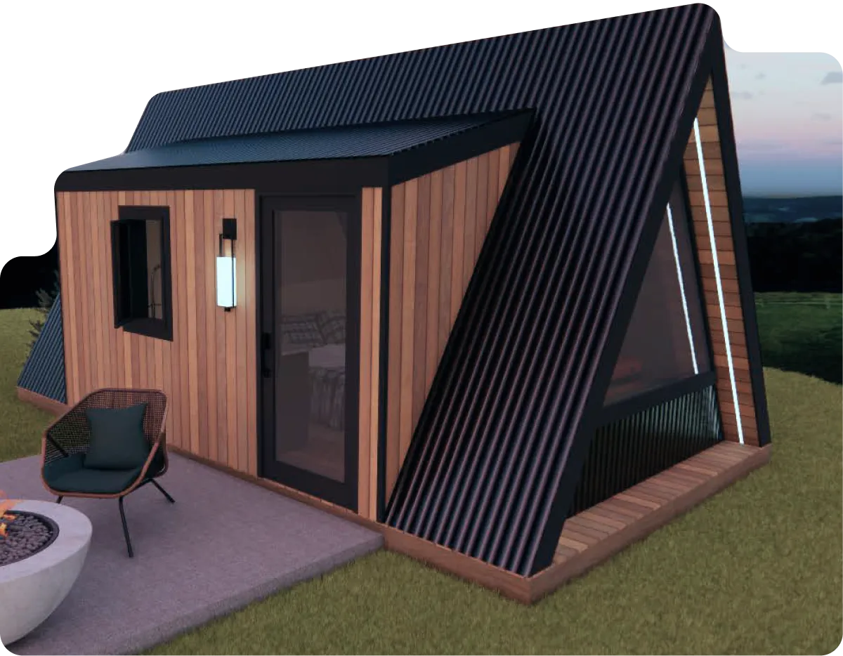 A modern A-frame tiny house with wood and black metal exterior, next to a fire pit and a round wooden hot tub, surrounded by grass and trees.
