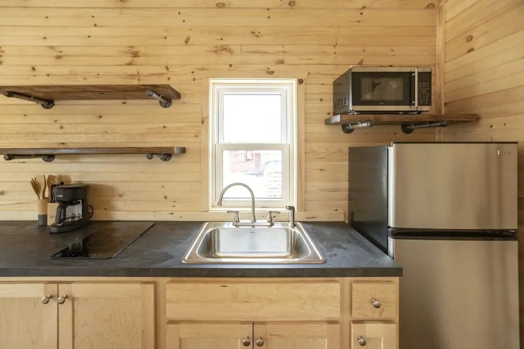 a modern kitchen inside of a cabin