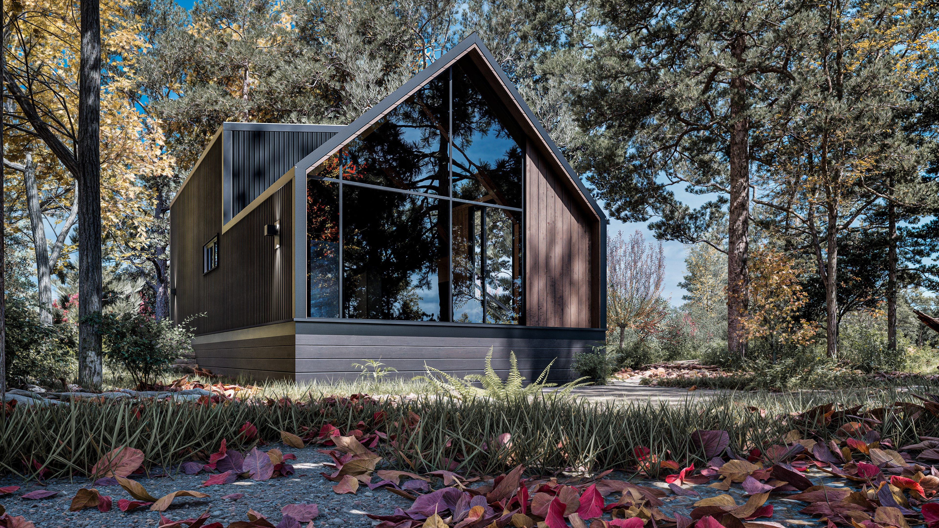 A modern cabin with large glass windows sits among trees in an autumn forest, with fallen leaves covering the ground in the foreground.