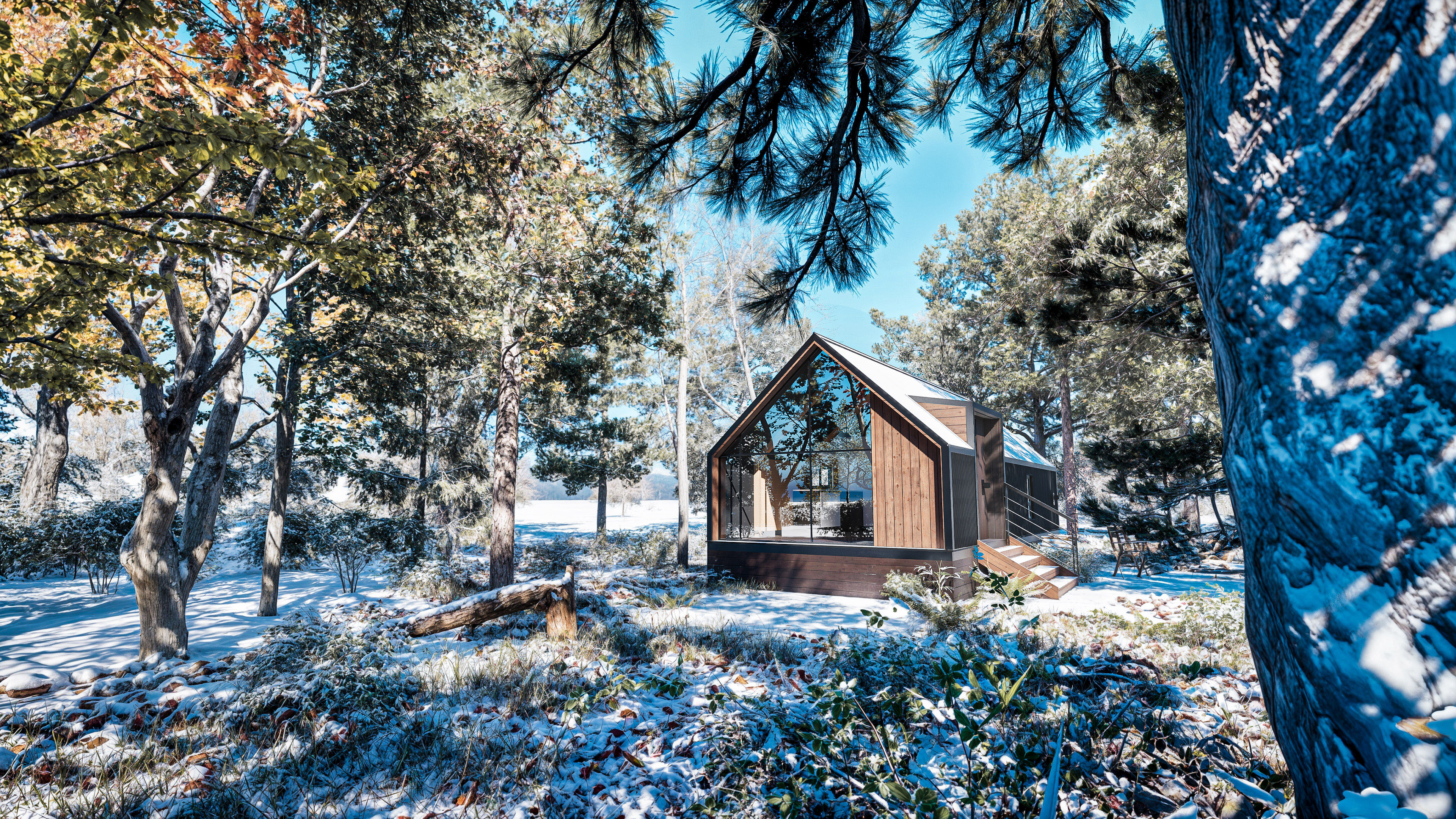 A small modern cabin with a triangular roof sits among snow-dusted trees in a forest clearing on a sunny winter day.