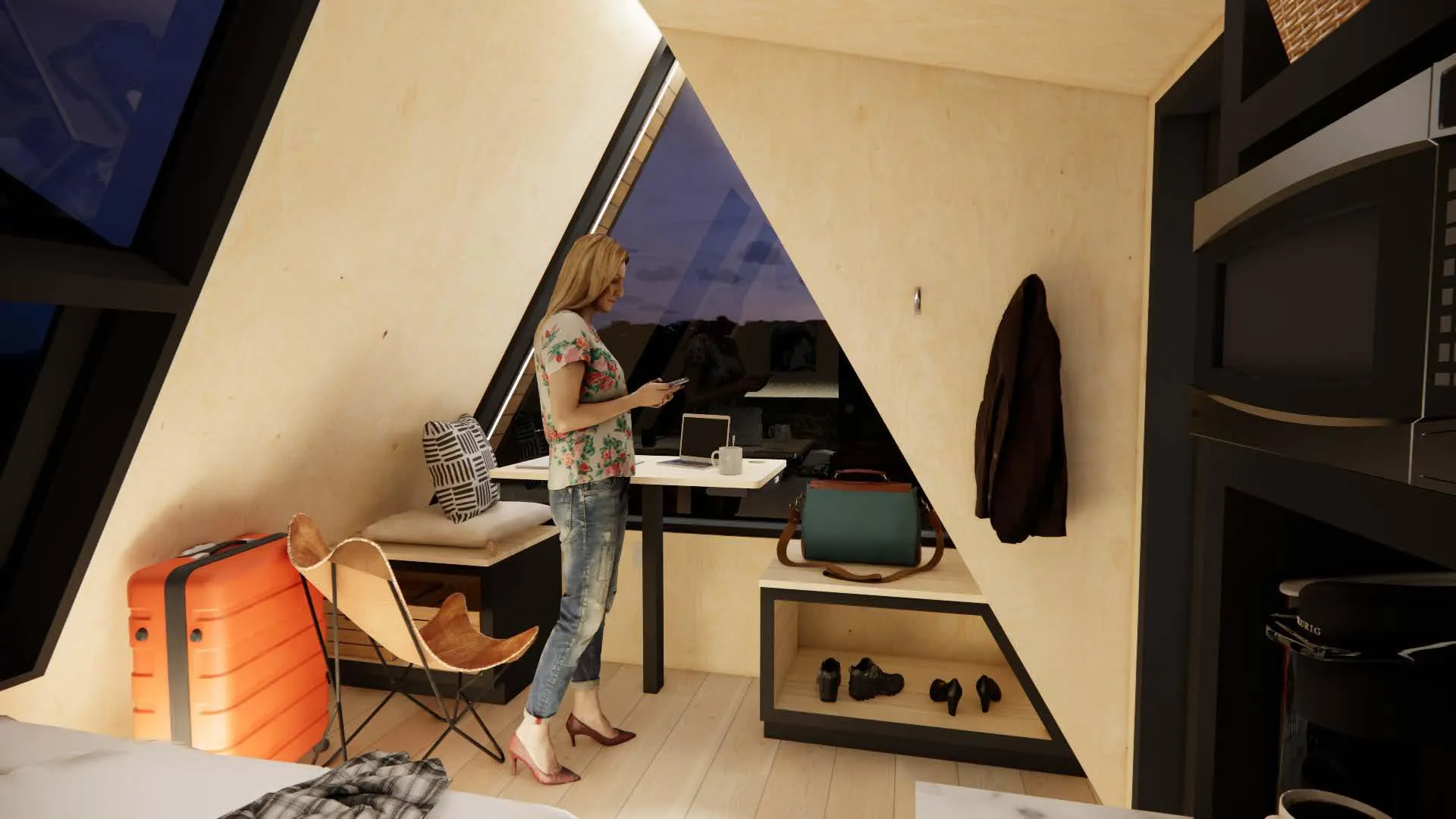 A woman stands in a modern A-frame cabin with wood-paneled walls, using her phone. Orange luggage, a desk, and various personal items are visible.