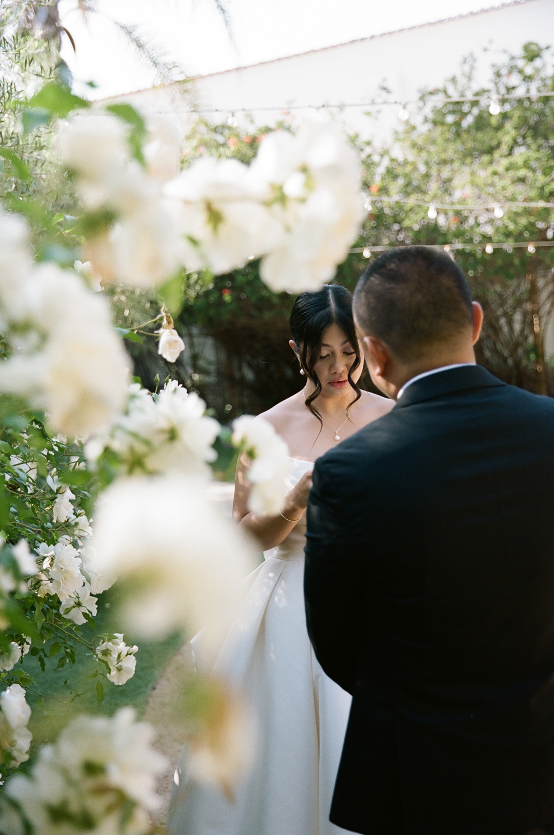 Bride shares personal vows with groom outside of The Casino.