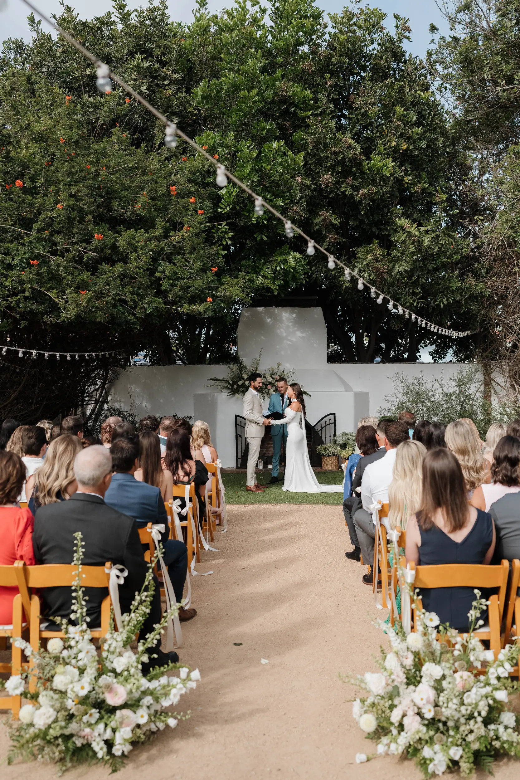 Bride and groom recite vows in front of family and friends.