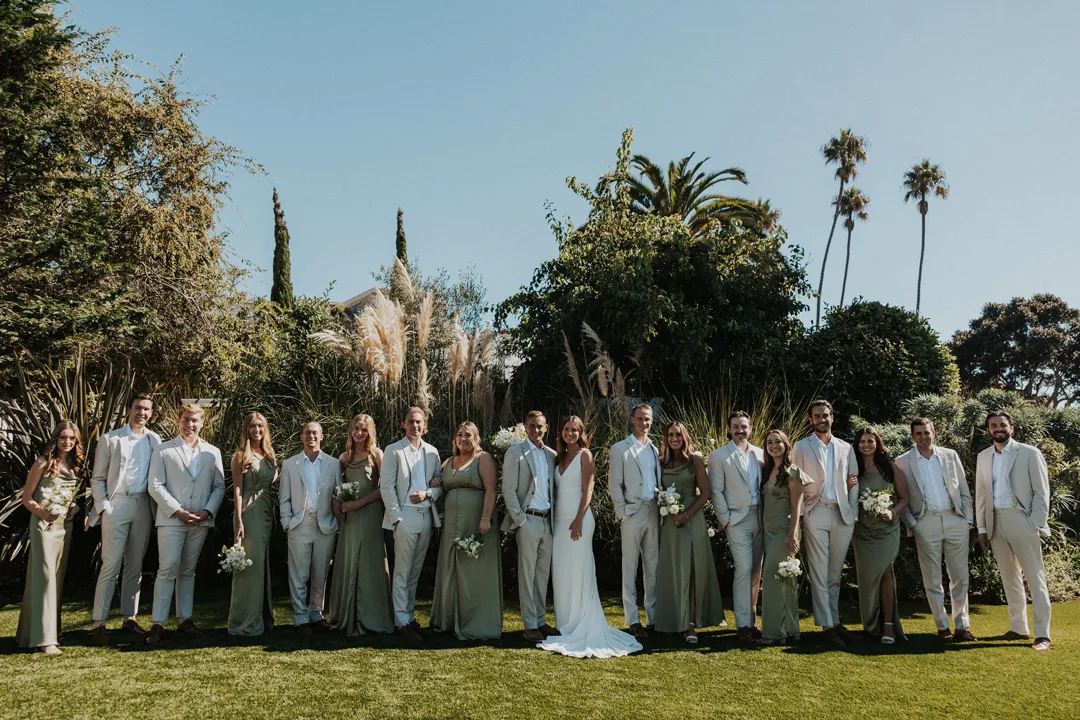 Wedding party poses on the Casino lawn.