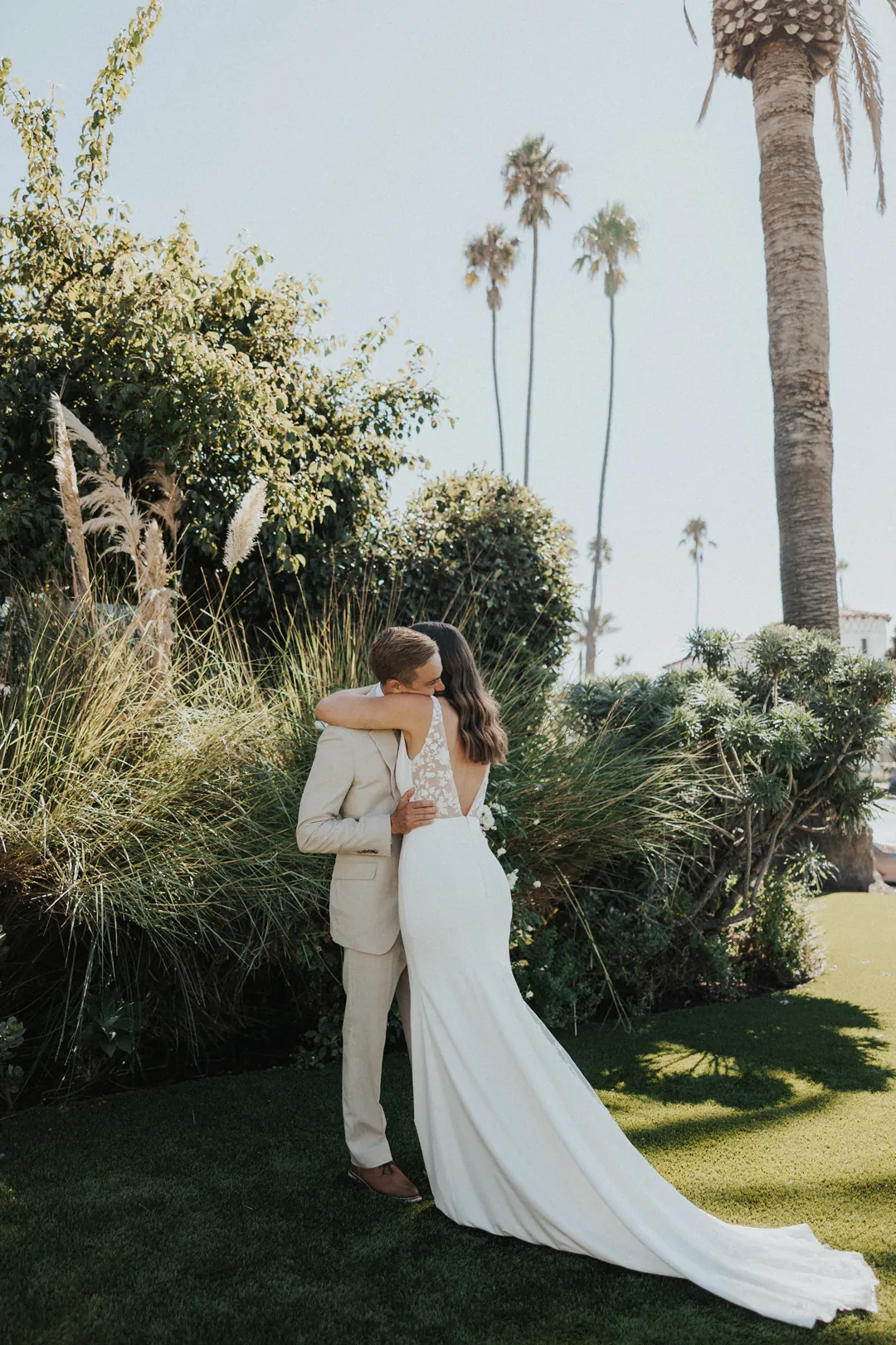 Bride and groom hug during first look.