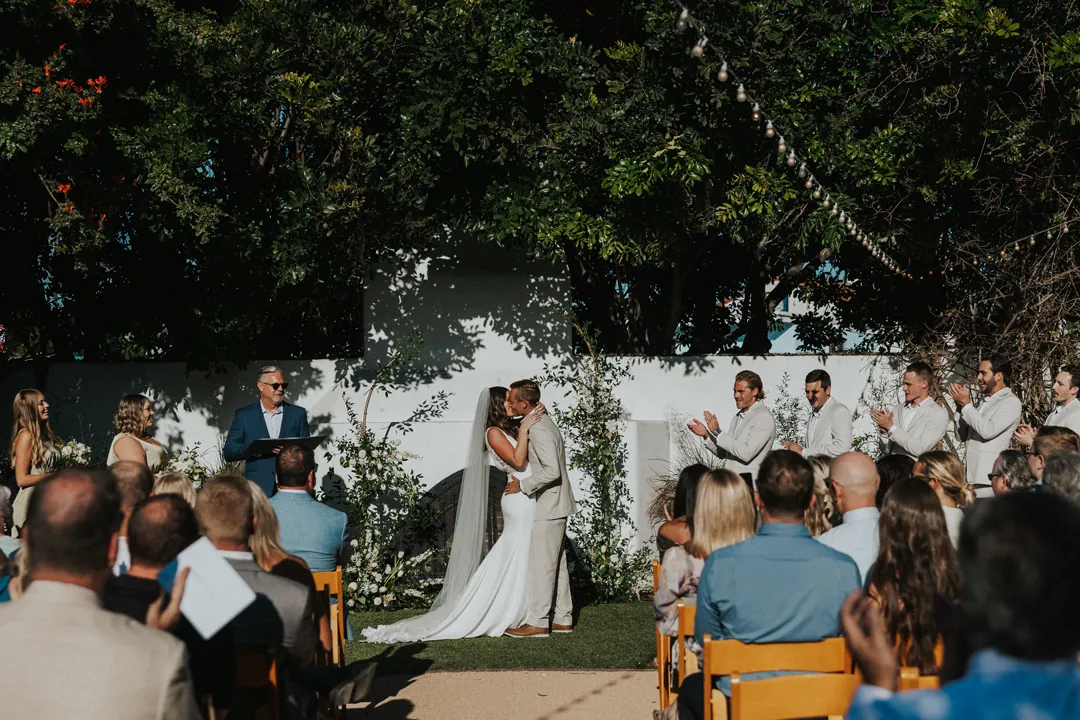 Bride and groom kiss to seal the ceremony.