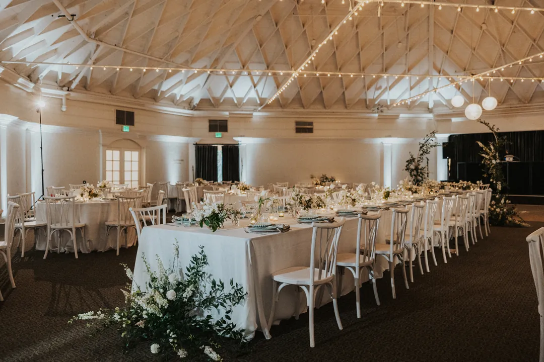 A coastal-style wedding reception sits inside The Casino's grand ballroom.