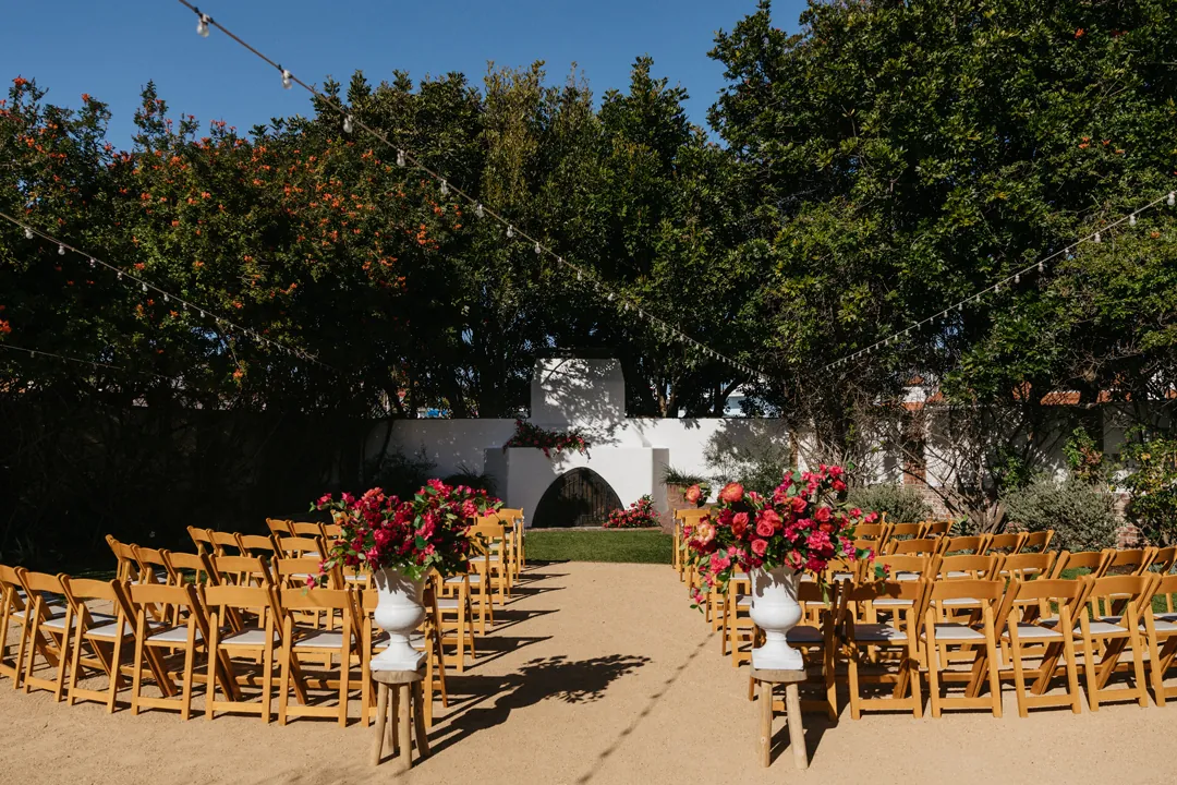 Colorful pink flowers decorate the Casino's Rock Garden for an outdoor wedding ceremony.