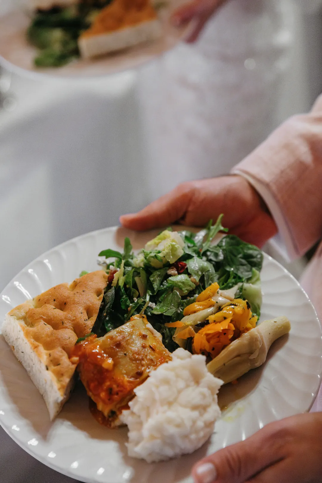 Pasta, potatoes, salad, and more filled plates for this Casino Wedding.
