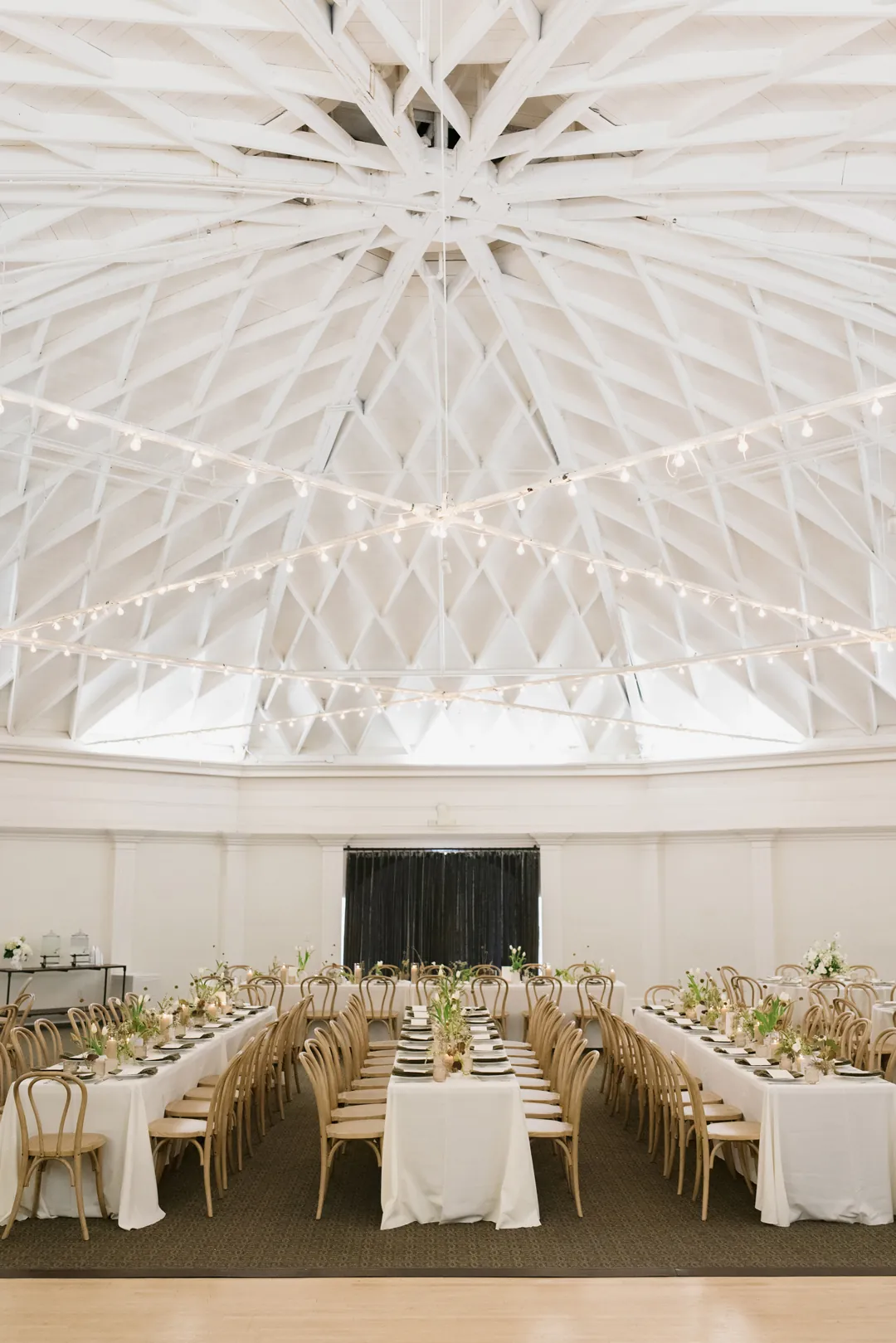 Coastal wedding decor fills the indoor ballroom at The Casino for a wedding.