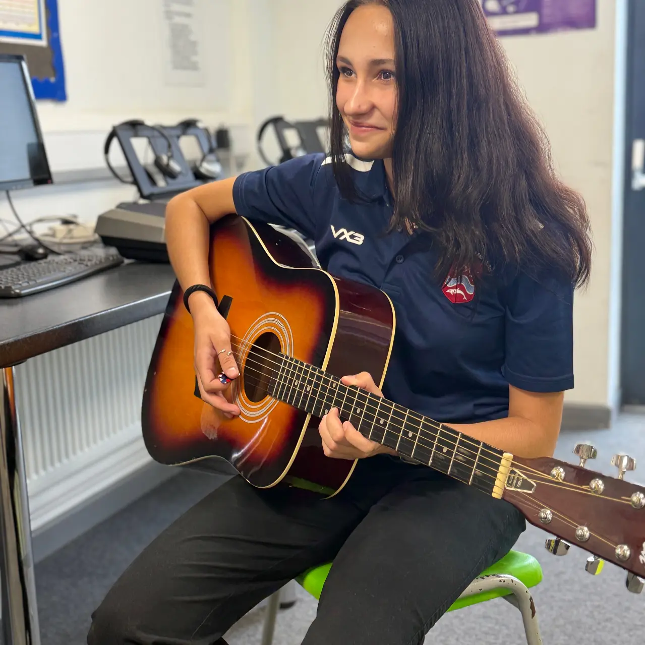 Student Playing Guitar