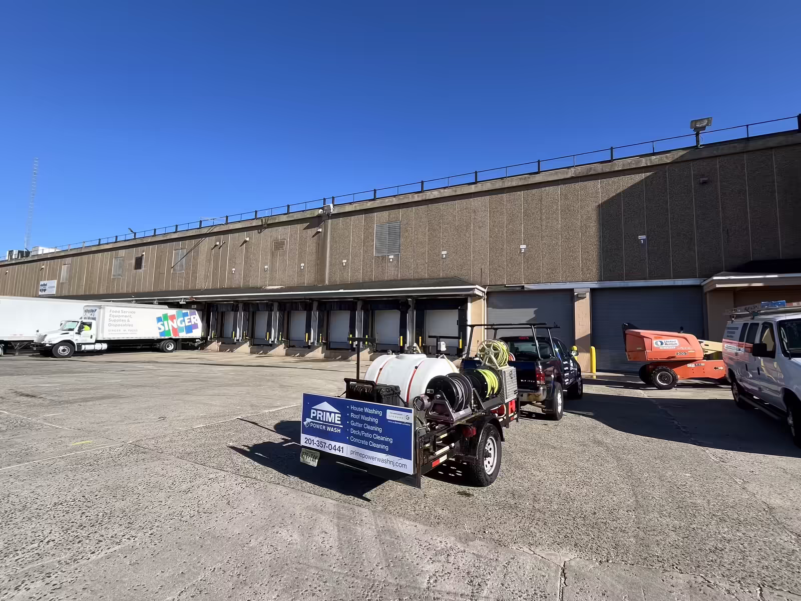 Commercial building exterior being professionally cleaned