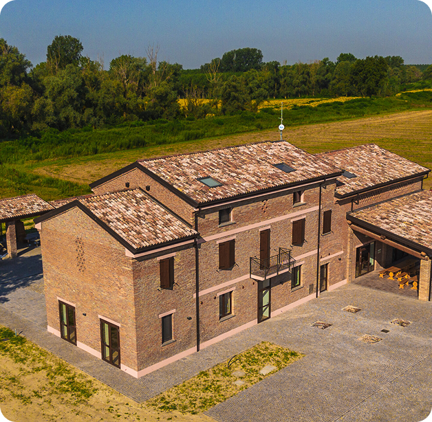 Wind turbine blades against a landscape.