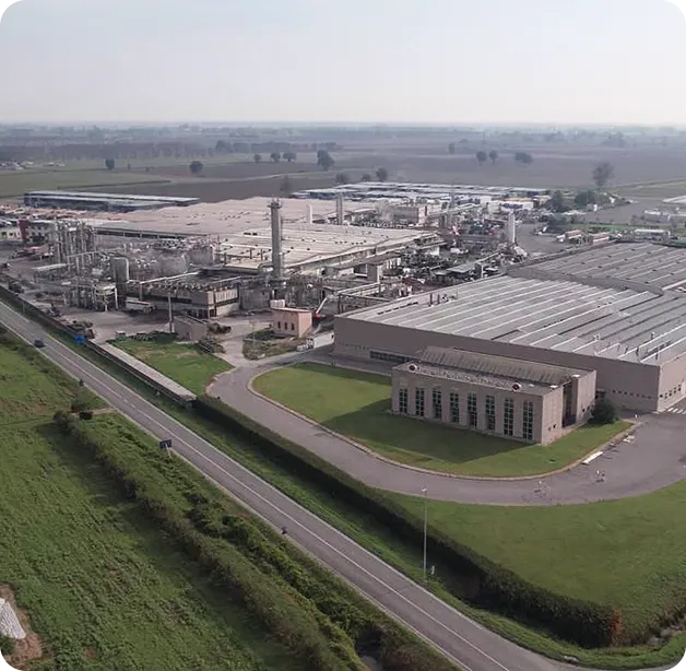 Wind turbine blades against a landscape.