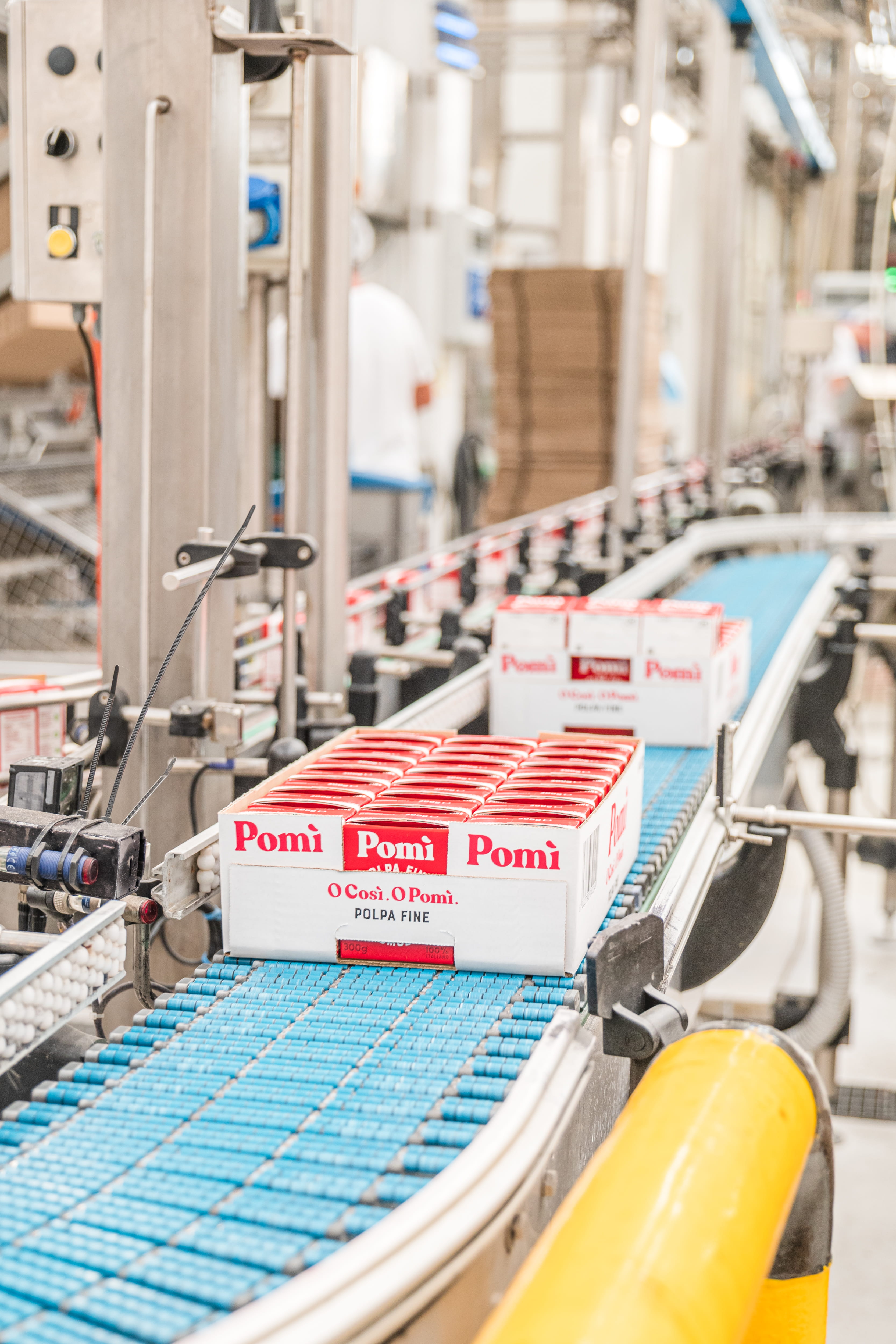 Wind turbine blades against a landscape.